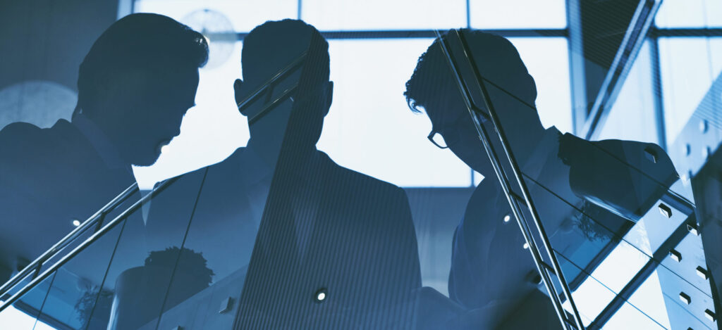 Reflection of three men